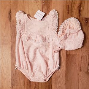 Beautiful onesie with matching bonnet.